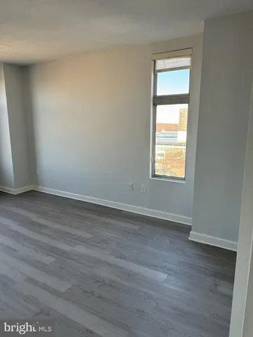 a kitchen with cabinets and window