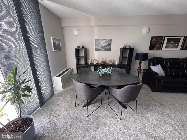 a kitchen with stainless steel appliances kitchen island wooden cabinets a sink and a counter top space