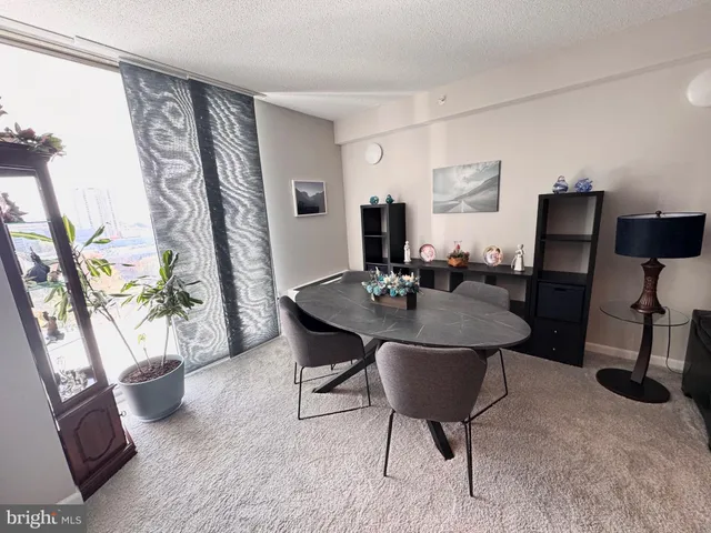 a kitchen with stainless steel appliances wooden cabinets a sink and a stove