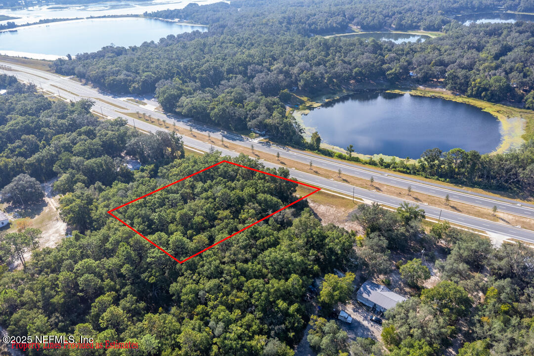 1926 Highway 20 Hawthorne, FL 32640 - Photo 4 of 13 an aerial view of residential houses with outdoor space and street view