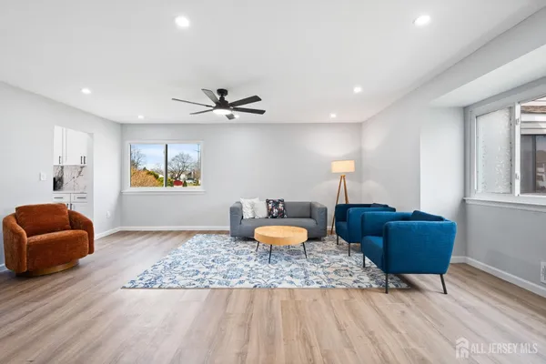 a living room with furniture and a window