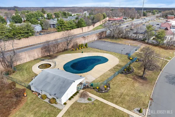 an aerial view of a house with swimming pool