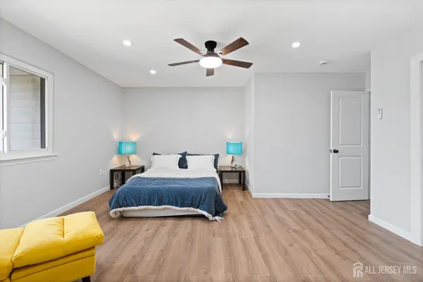 a bedroom with bed and window