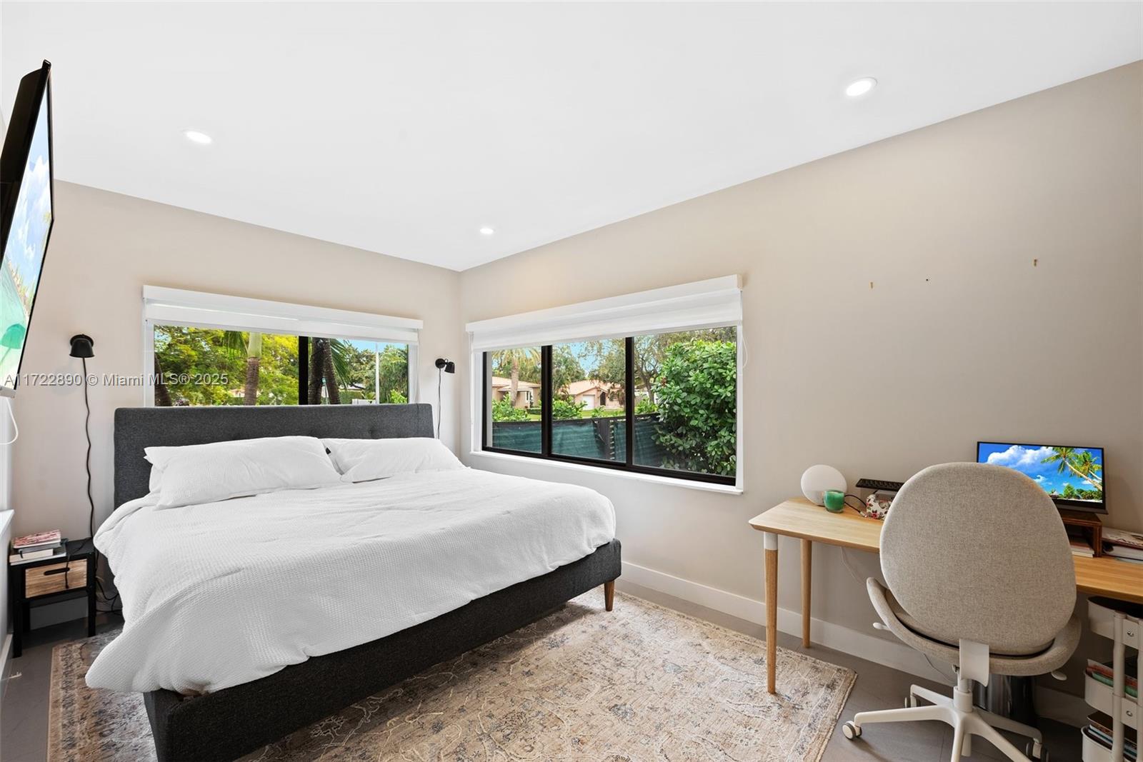 620 Cardinal Street Miami Springs, FL 33166 - Photo 12 of 24 a bedroom with a bed a window and chair
