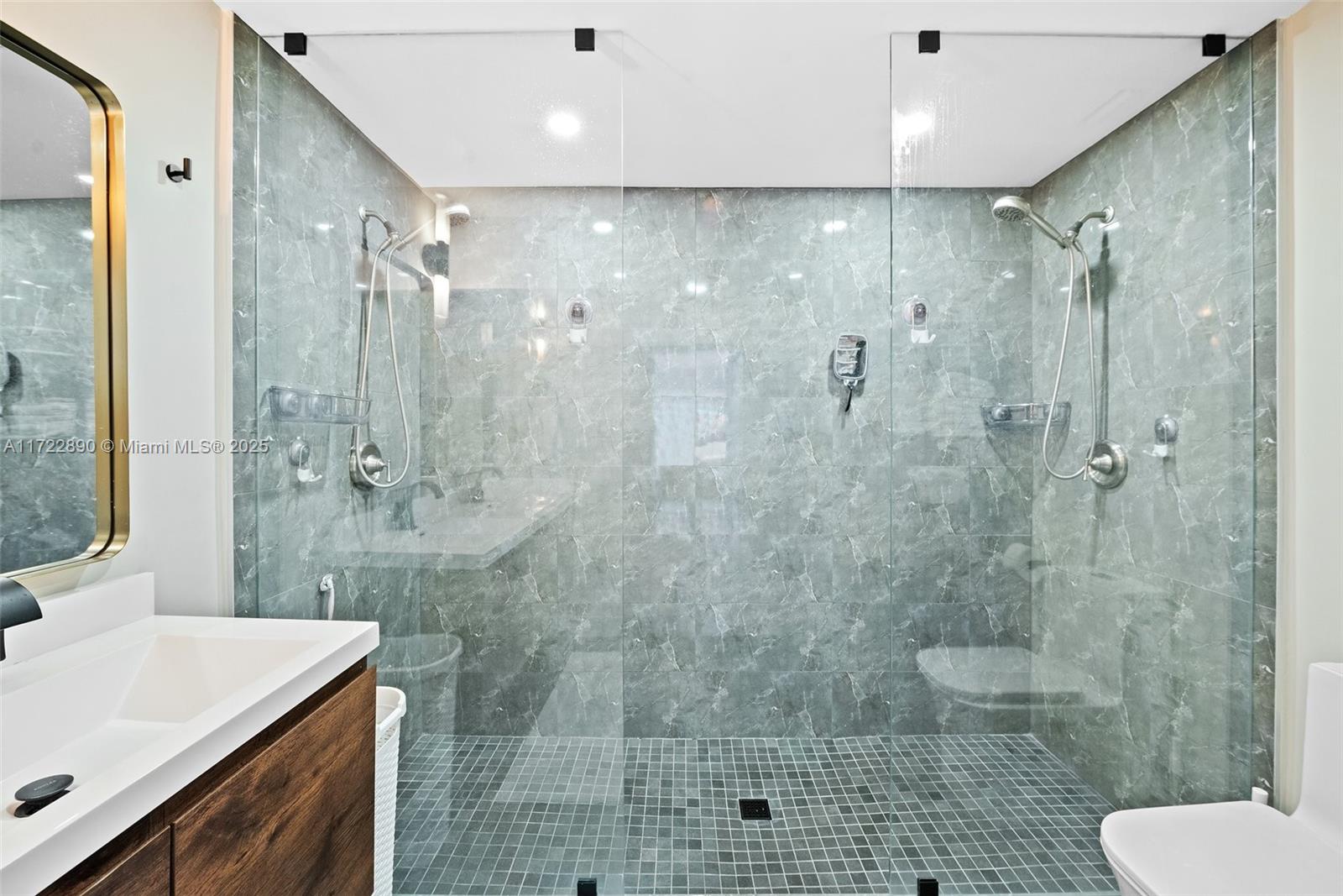 620 Cardinal Street Miami Springs, FL 33166 - Photo 14 of 24 a bathroom with a shower sink vanity and toilet