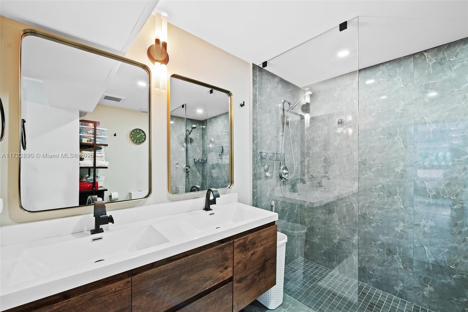 620 Cardinal Street Miami Springs, FL 33166 - Photo 15 of 24 a bathroom with a sink and a mirror