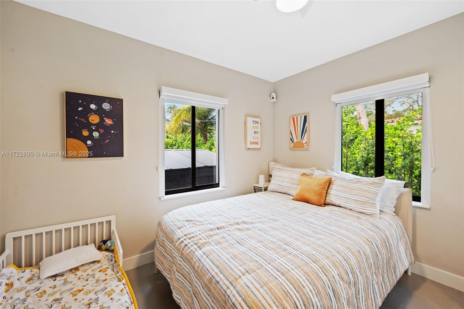 620 Cardinal Street Miami Springs, FL 33166 - Photo 16 of 24 a bedroom with a bed and a window