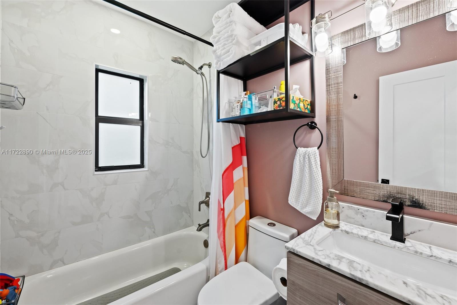 620 Cardinal Street Miami Springs, FL 33166 - Photo 17 of 24 a bathroom with a granite countertop sink a toilet and shower