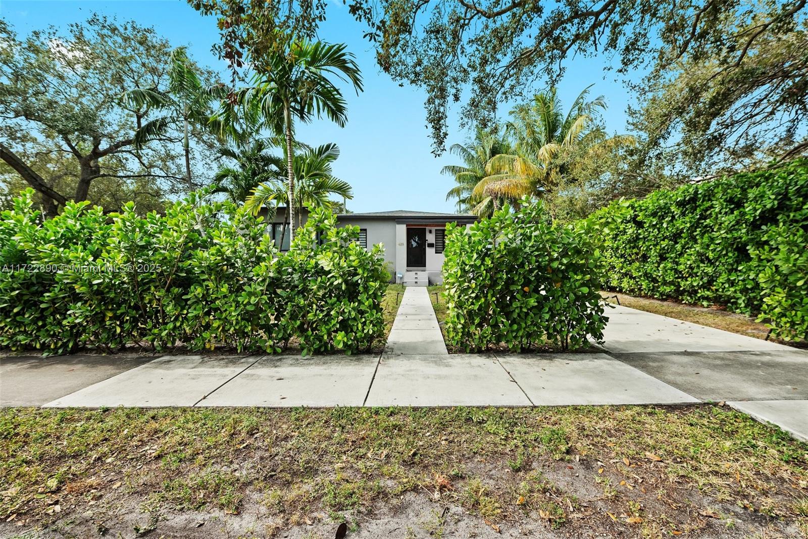 620 Cardinal Street Miami Springs, FL 33166 - Photo 2 of 24 a view of path along with trees