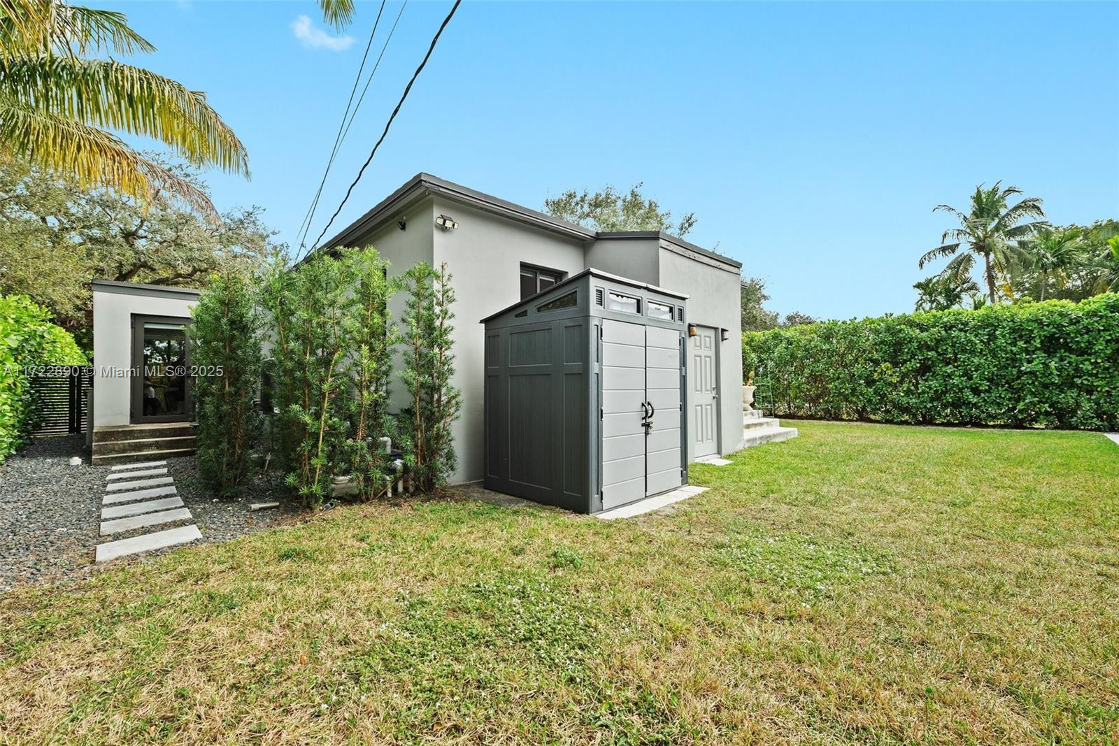620 Cardinal Street Miami Springs, FL 33166 - Photo 24 of 24 a view of a house with a yard and plants