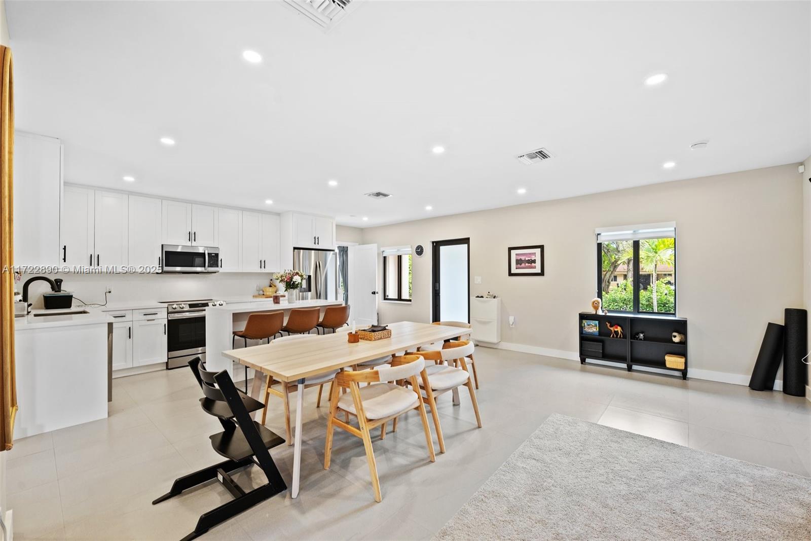 620 Cardinal Street Miami Springs, FL 33166 - Photo 5 of 24 a view of a dining room with furniture and a livingroom