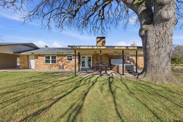 a view of a house with swimming pool