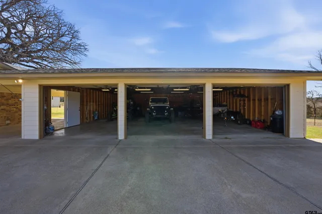 a view of swimming pool with a patio and a yard