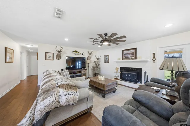 a living room with furniture and a fireplace