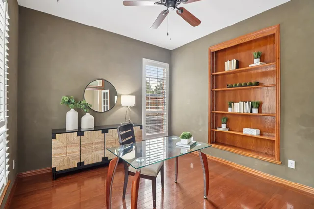 a view of a livingroom with furniture and a window