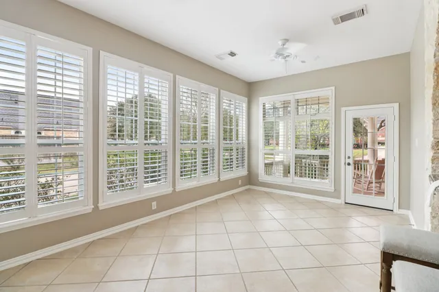 a view of entryway and hall with dining room