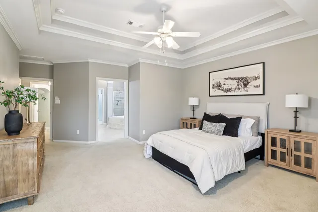 a spacious bathroom with a tub shower and sink