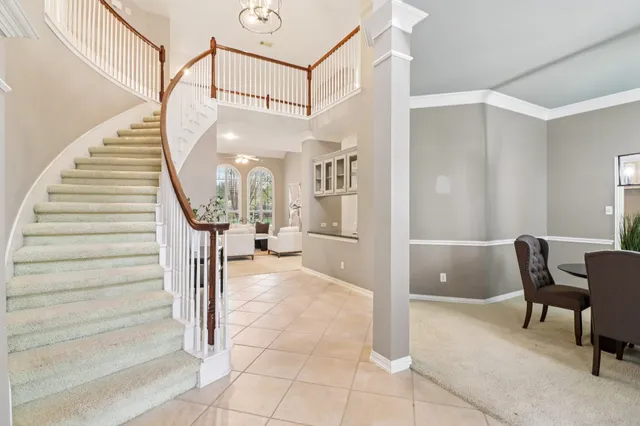 a view of a livingroom with furniture and stairs