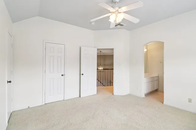 a white toilet sitting next to a bath tub