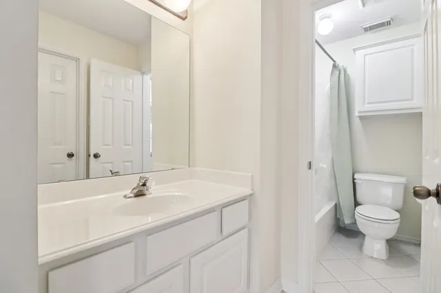 an empty room with a bathroom