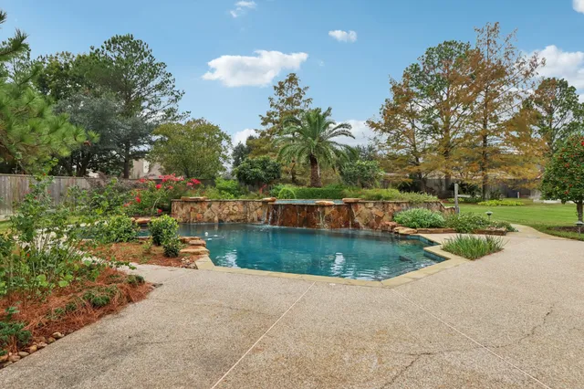 a view of a house with swimming pool