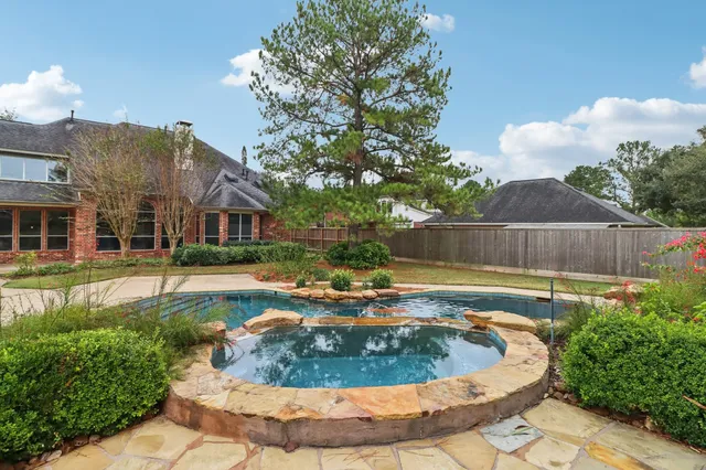 a view of a water fountain in front of the house