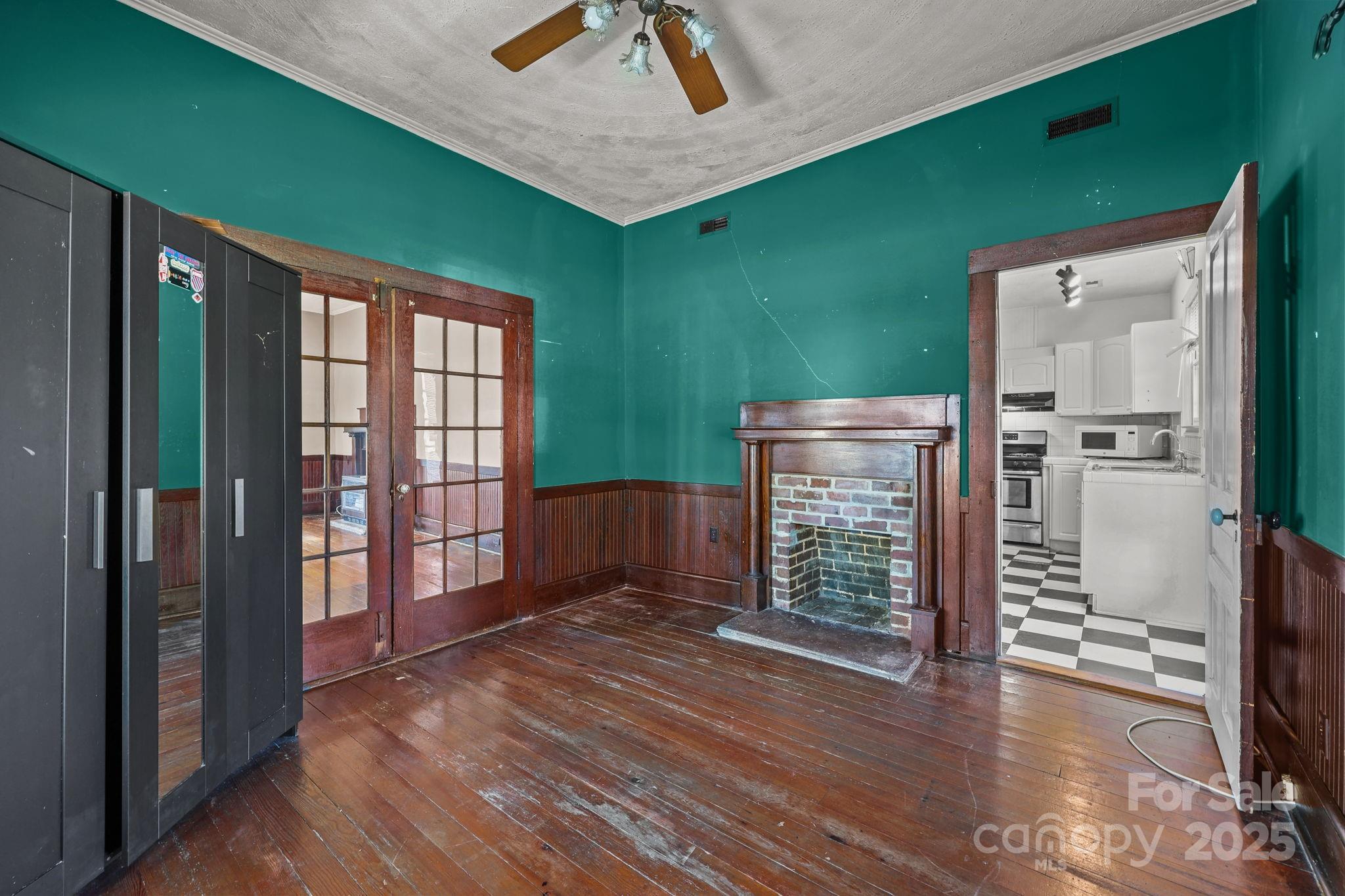 123 North Main Street Salisbury, NC 28144 - Photo 11 of 47 an empty room with wooden floor and windows