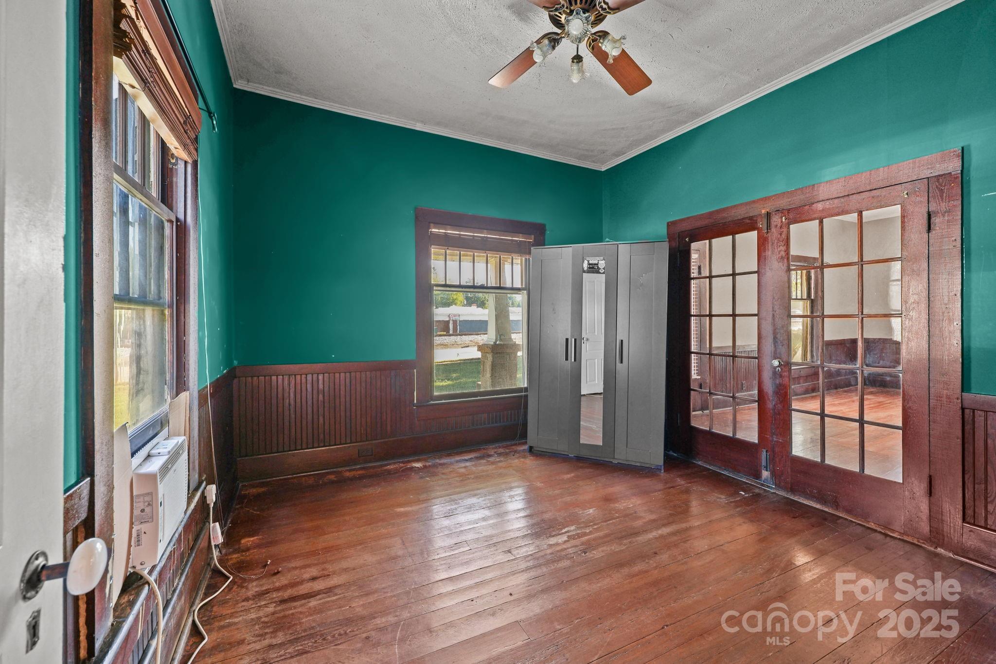123 North Main Street Salisbury, NC 28144 - Photo 12 of 47 a view of an empty room with a window and wooden floor