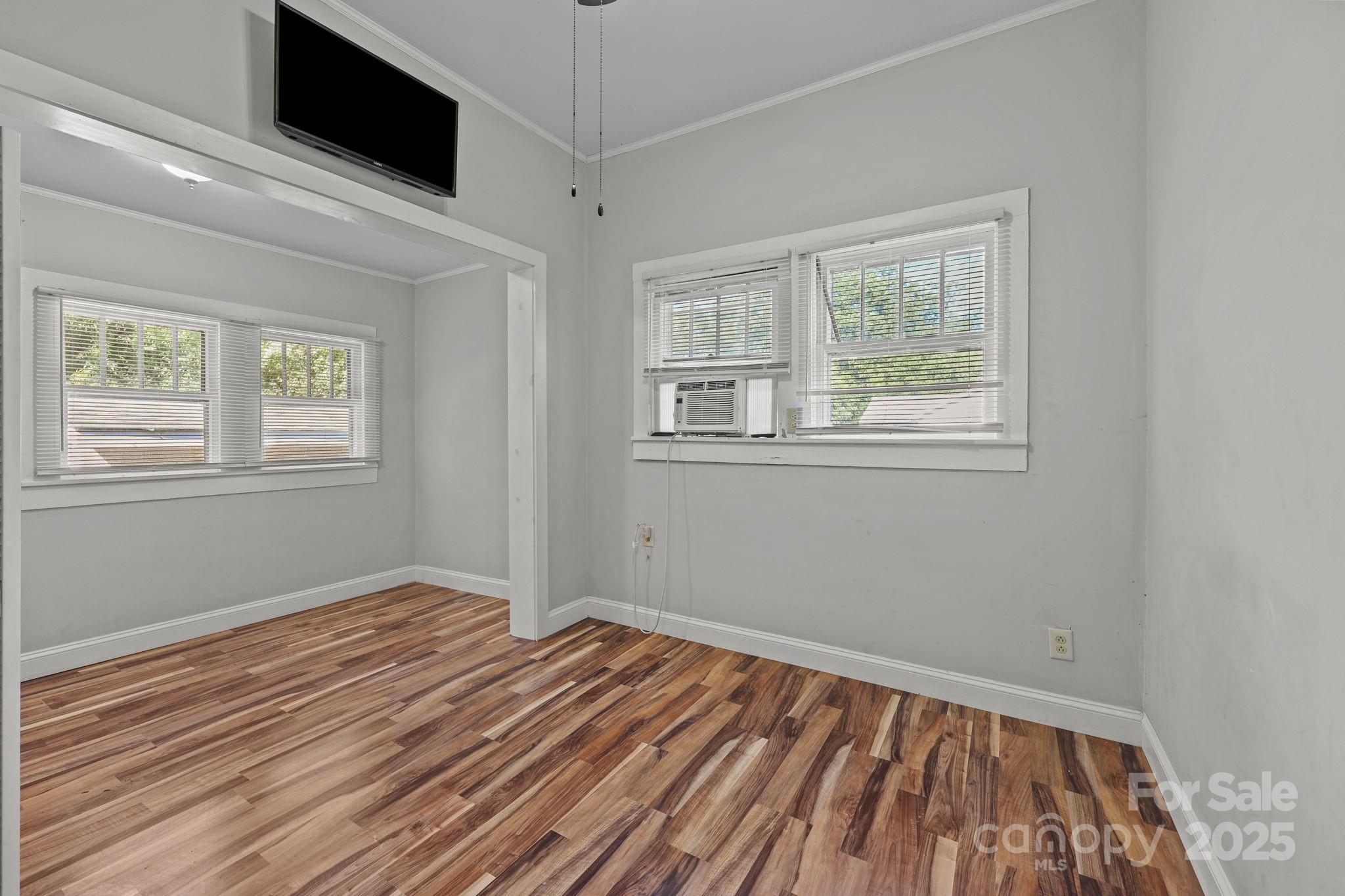 123 North Main Street Salisbury, NC 28144 - Photo 20 of 47 a view of empty room with wooden floor and fan