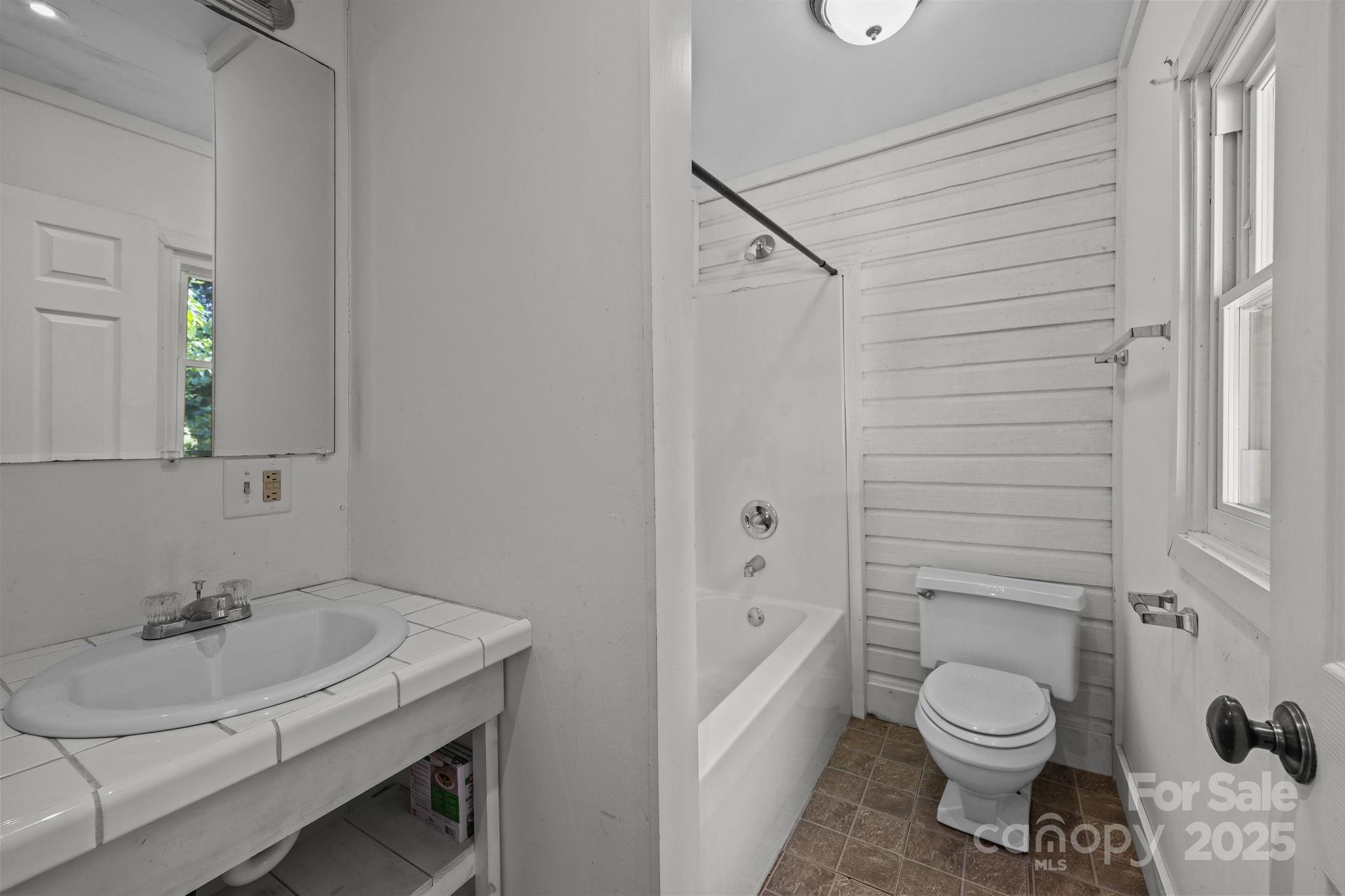 123 North Main Street Salisbury, NC 28144 - Photo 22 of 47 a bathroom with a sink toilet and shower