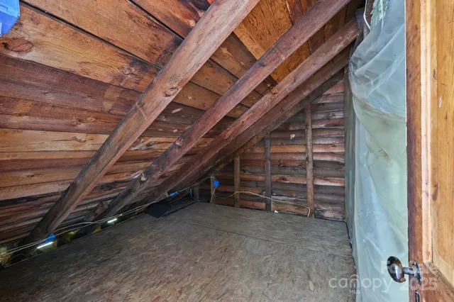 a view of an empty room with a stairs