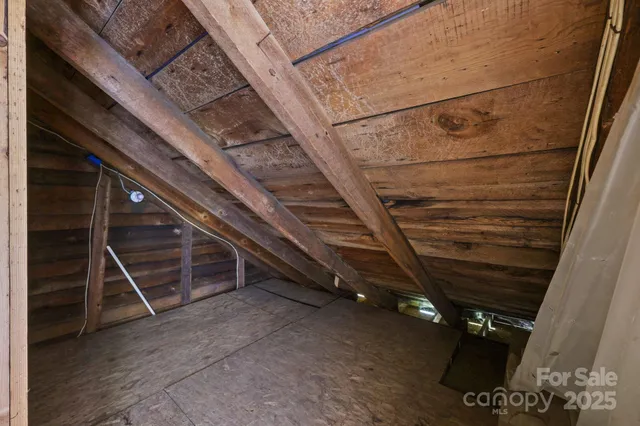 a front view of a house with a garden and yard