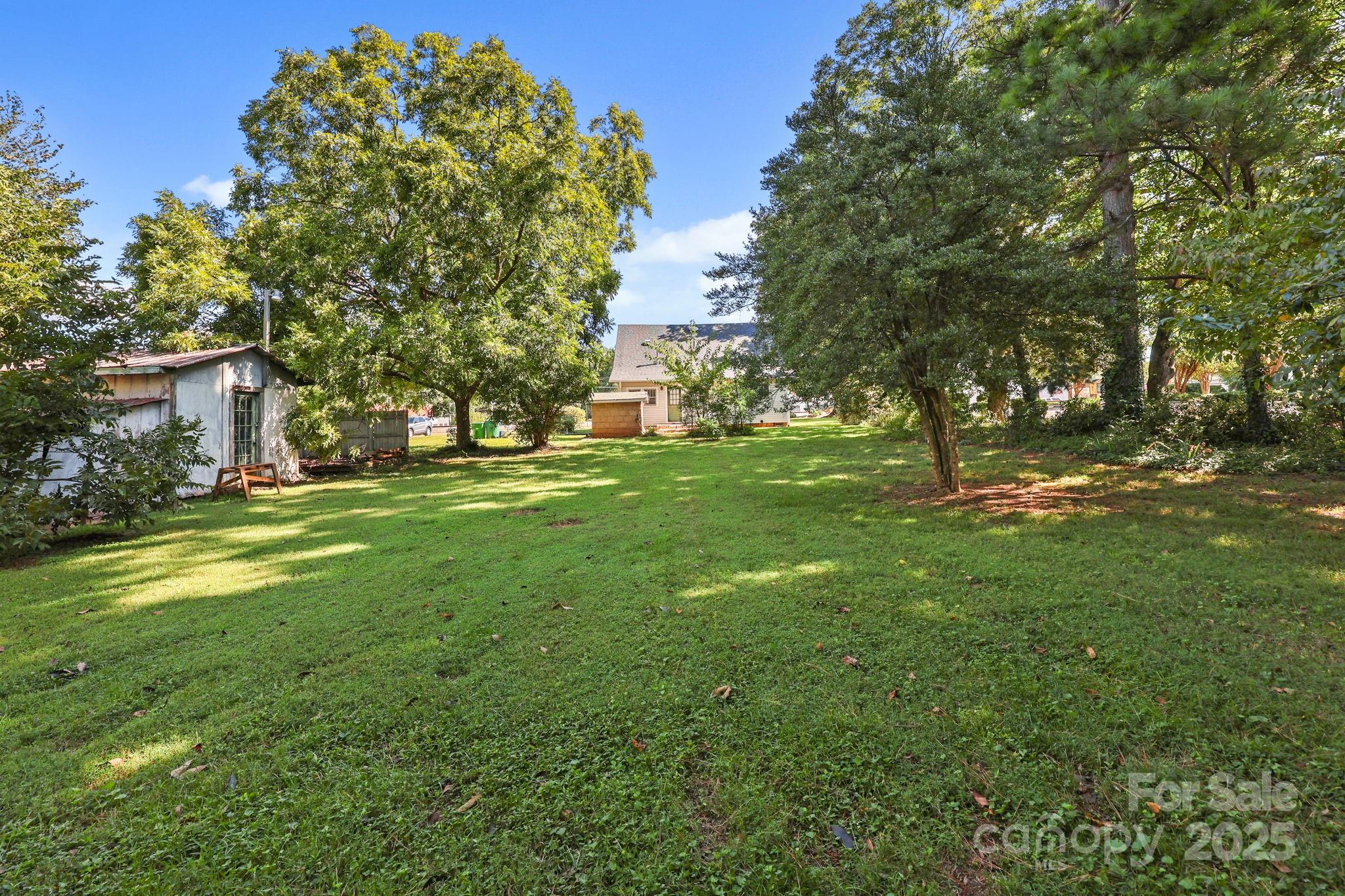 123 North Main Street Salisbury, NC 28144 - Photo 40 of 47 a backyard of a house with lots of green space