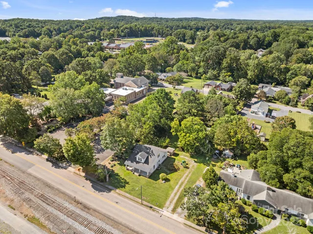 a view of a tree in front of a house