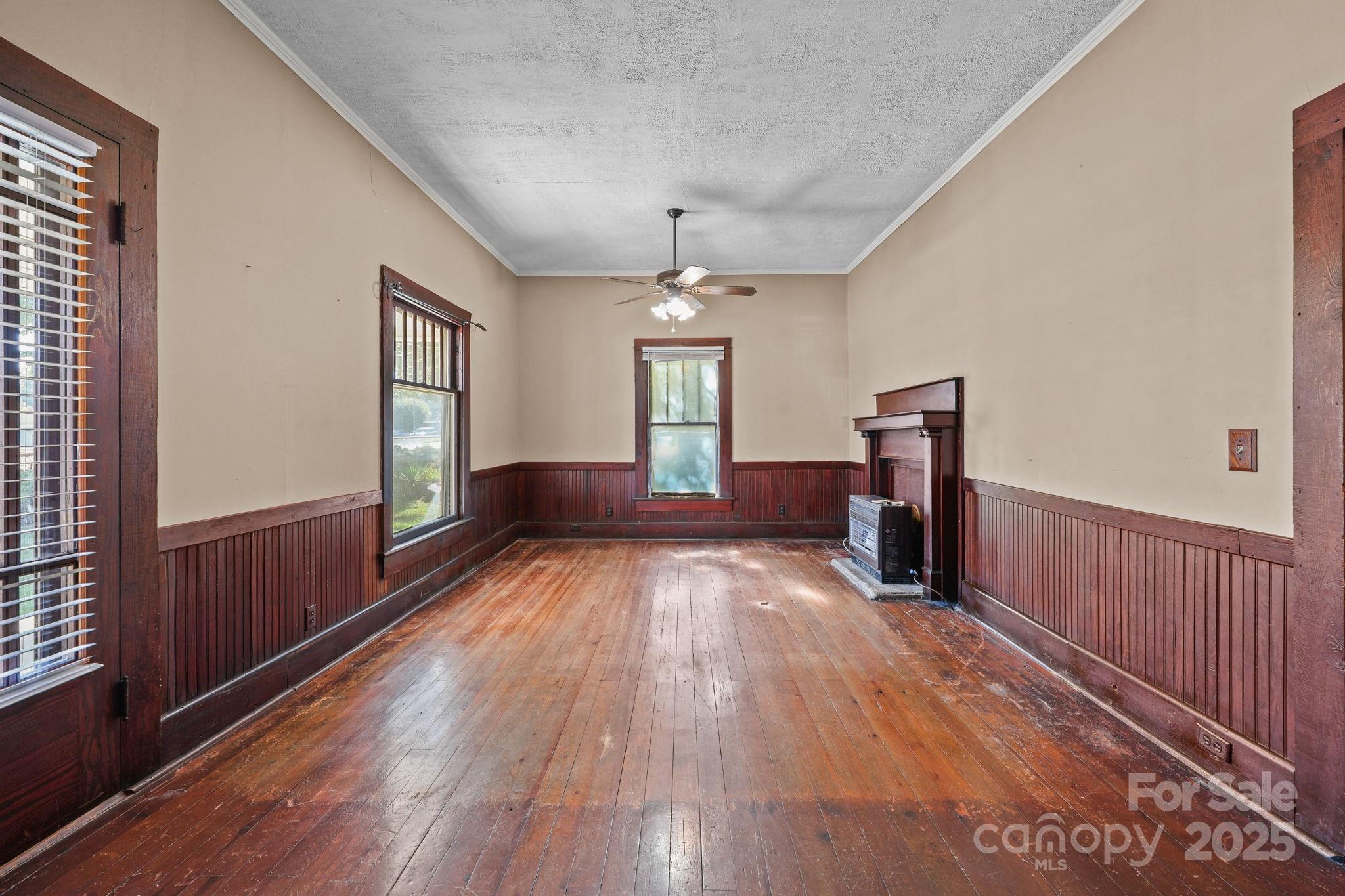 123 North Main Street Salisbury, NC 28144 - Photo 10 of 47 a view of empty room with wooden floor and fan