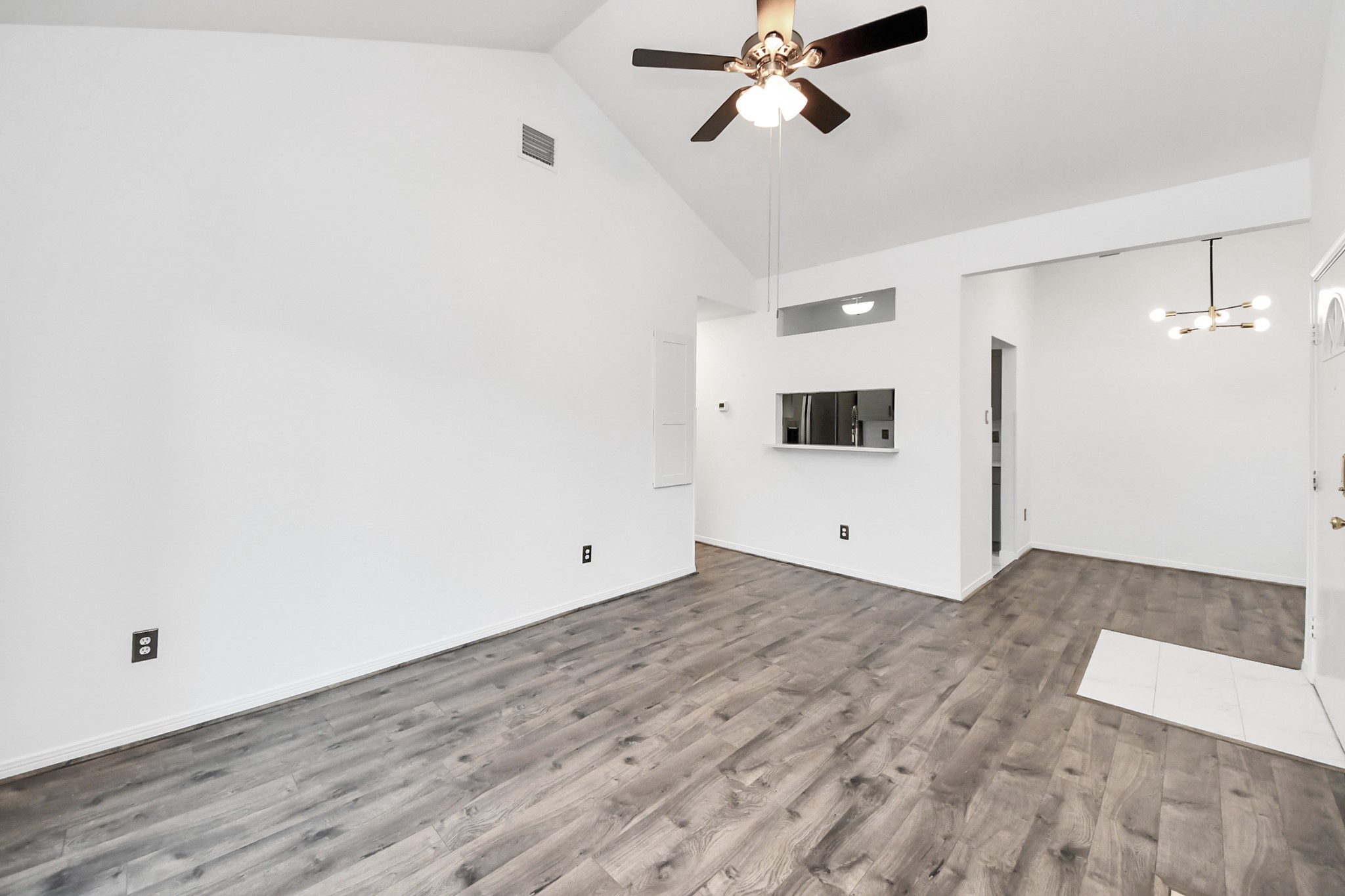 3500 Tangle Brush Drive, Unit 186 Spring, TX 77381 - Photo 12 of 43 a view of a room with wooden floor and white walls