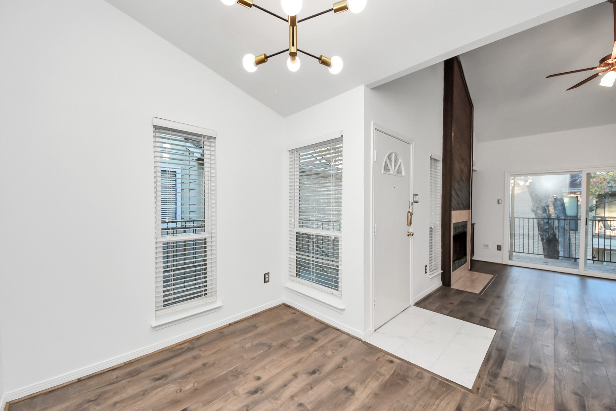 3500 Tangle Brush Drive, Unit 186 Spring, TX 77381 - Photo 15 of 43 a view of an empty room with wooden floor and a window