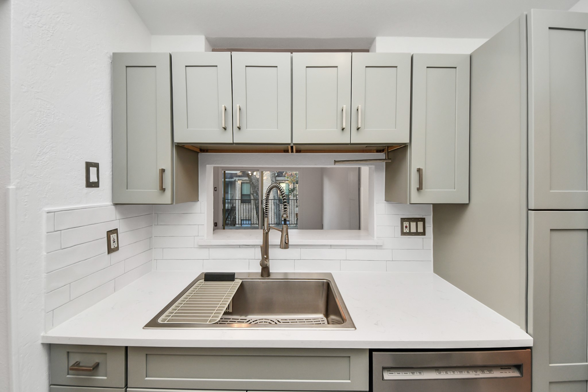 3500 Tangle Brush Drive, Unit 186 Spring, TX 77381 - Photo 20 of 43 a kitchen with white cabinets and black appliances
