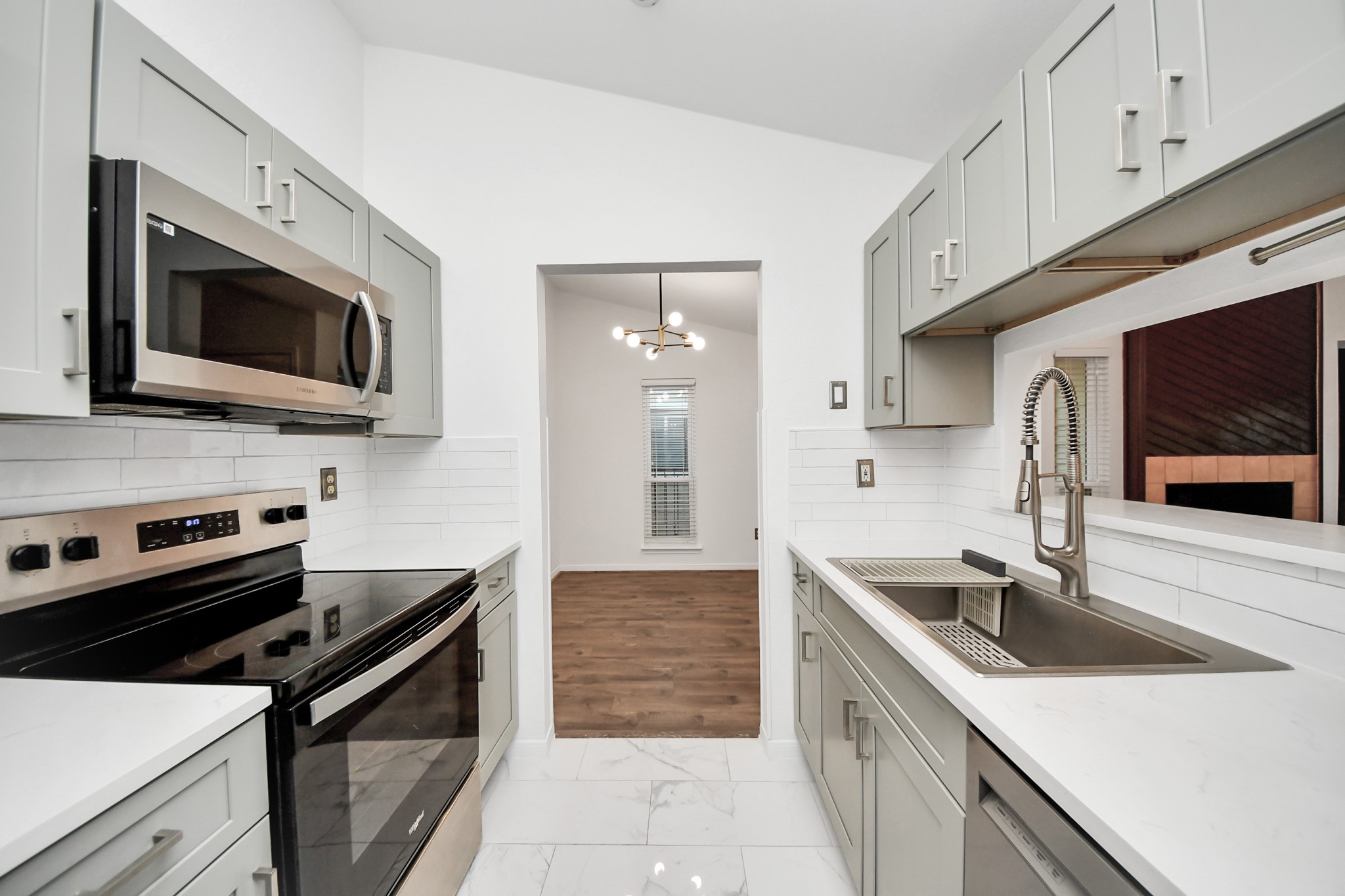 3500 Tangle Brush Drive, Unit 186 Spring, TX 77381 - Photo 25 of 43 a kitchen with stainless steel appliances granite countertop a sink and stove top oven