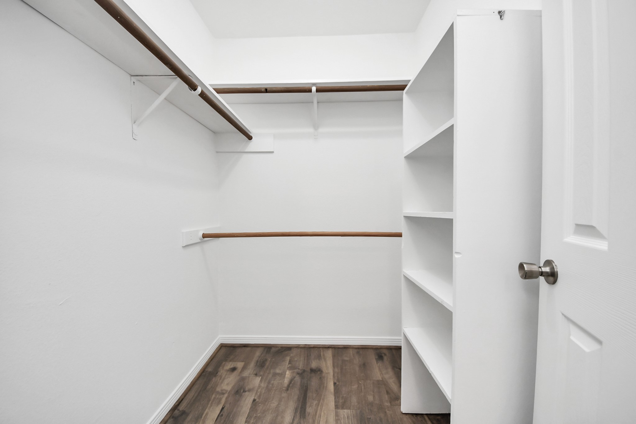3500 Tangle Brush Drive, Unit 186 Spring, TX 77381 - Photo 32 of 43 a view of walk in closet with empty racks