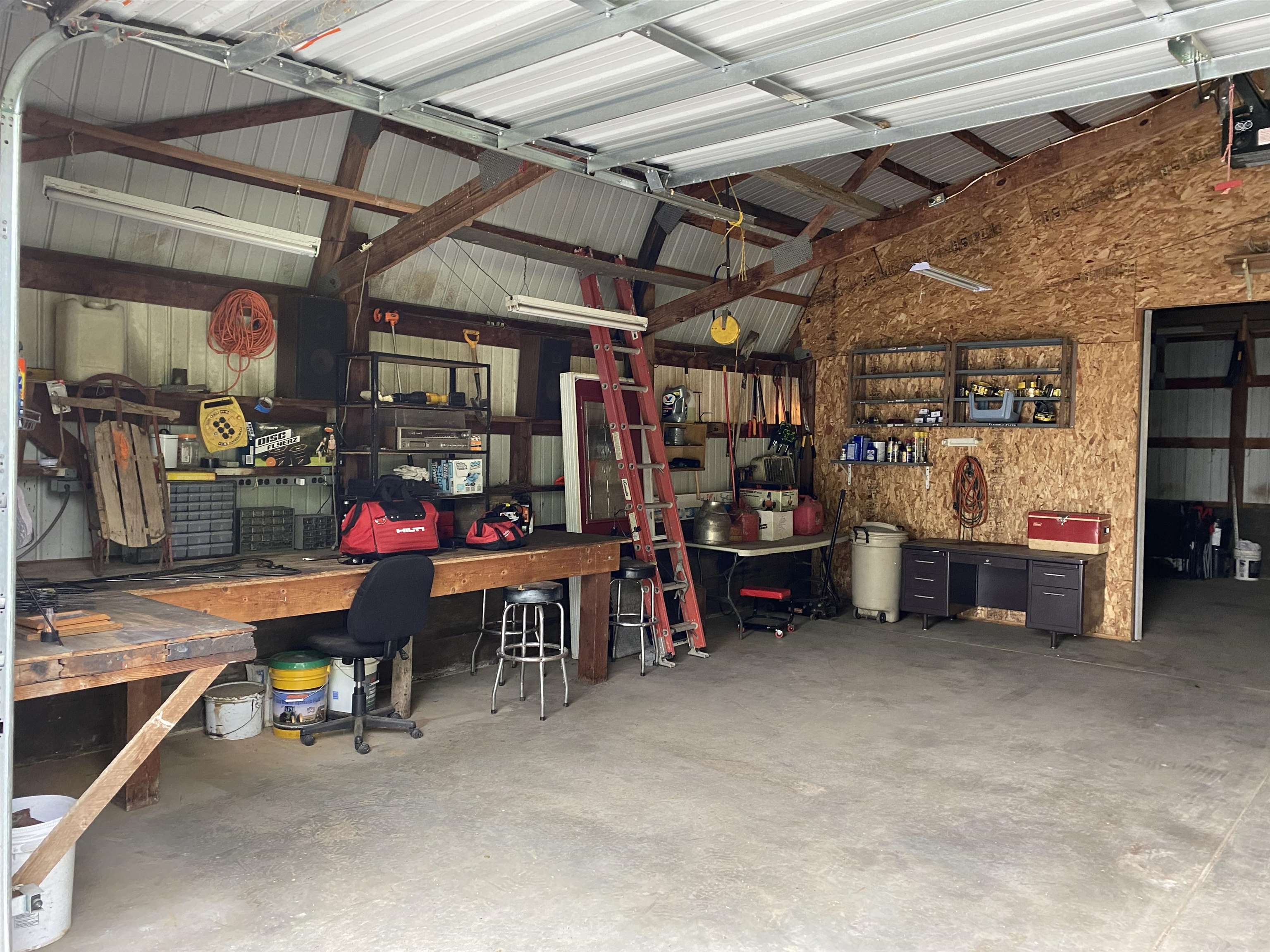 4482 East Lamm Road Freeport, IL 61032 - Photo 29 of 47 a view of a garage with a table and chairs