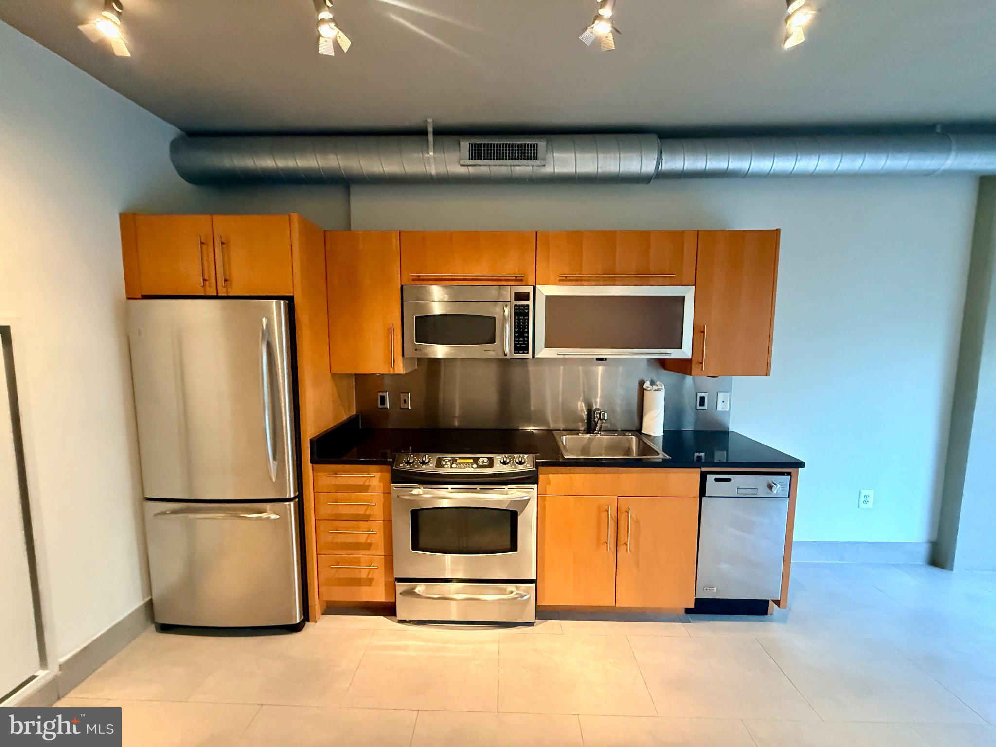 1133 14th Street Northwest, Unit 503 Washington, DC 20005 - Photo 5 of 29 Sleek urban kitchen with modern finishes.