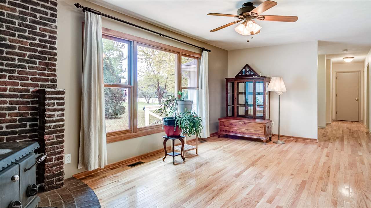 34477 Wheeler Road Kirkland, IL 60146 - Photo 3 of 25 a living room with furniture and a large window