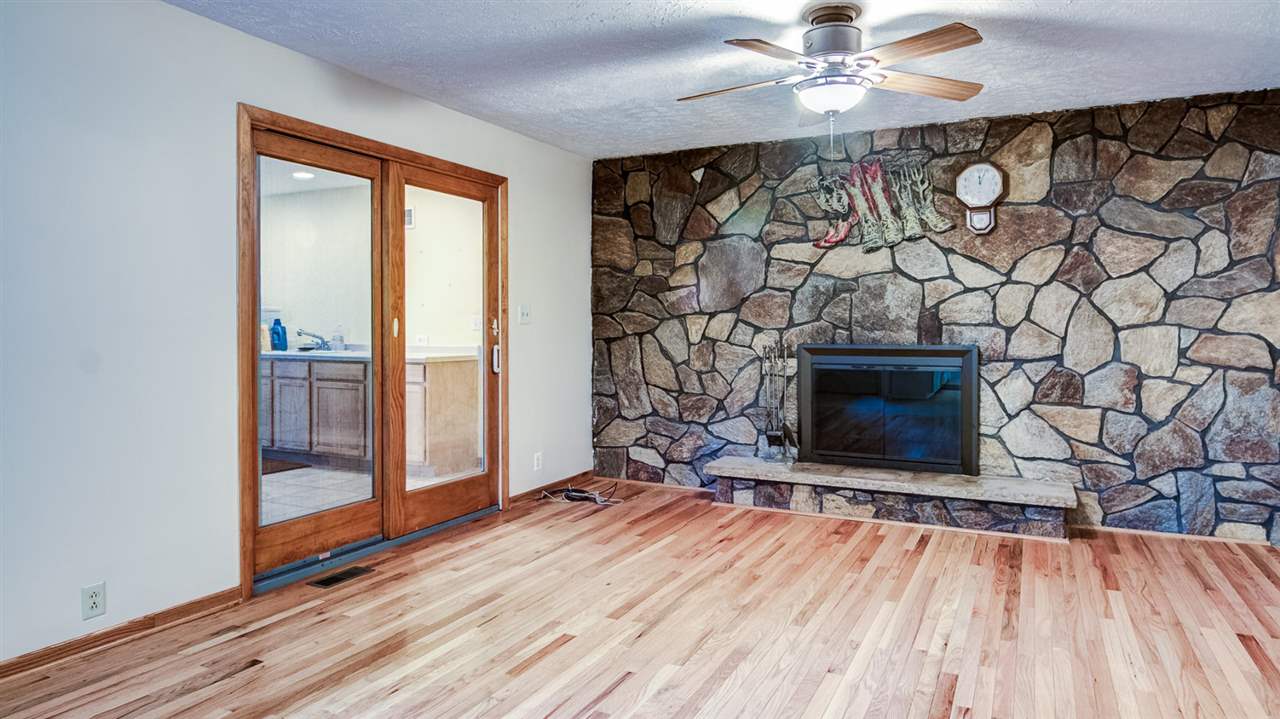 34477 Wheeler Road Kirkland, IL 60146 - Photo 6 of 25 a living room with a fireplace