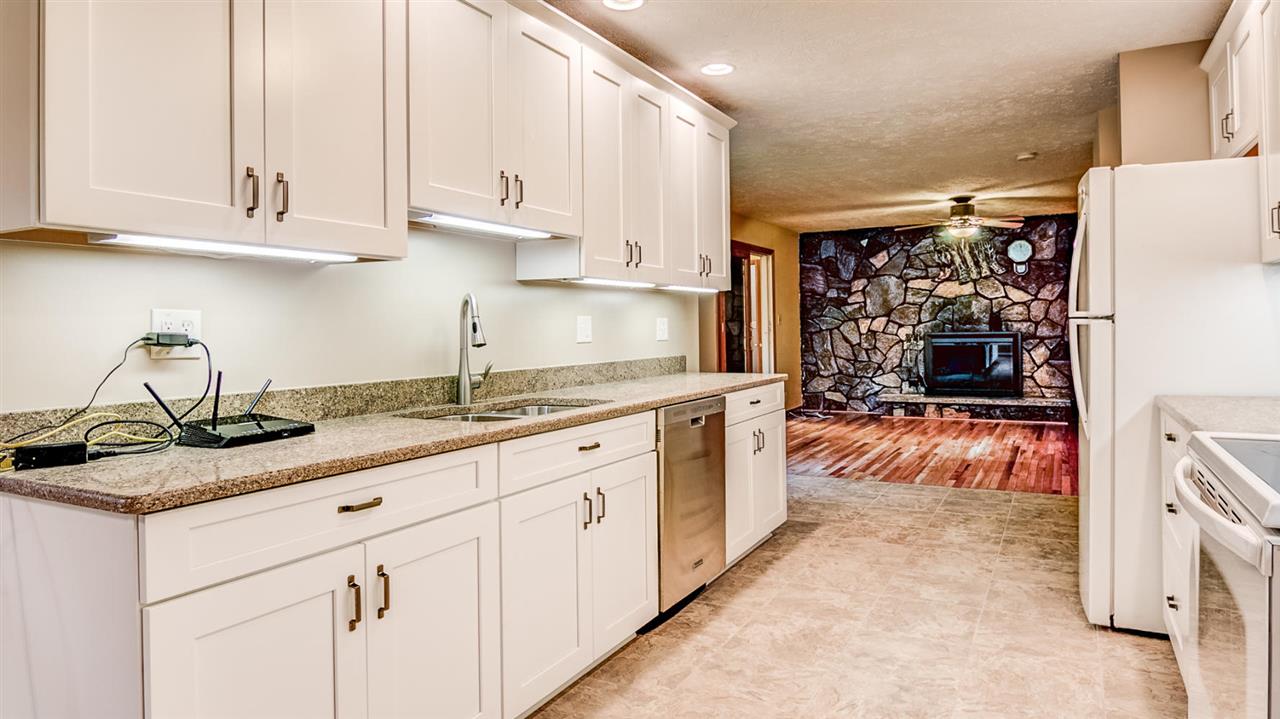 34477 Wheeler Road Kirkland, IL 60146 - Photo 8 of 25 a kitchen with white cabinets and sink