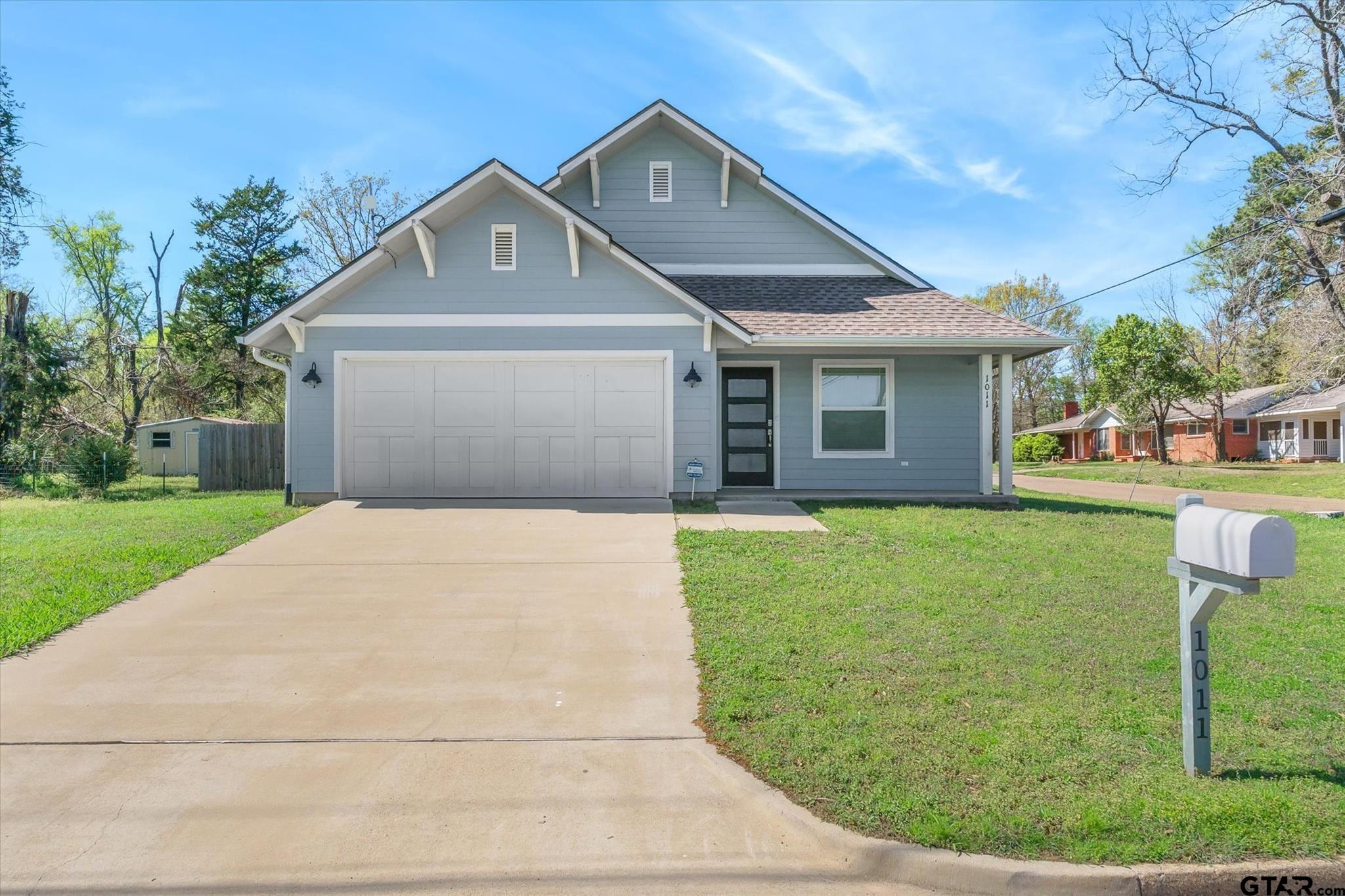 1011 Athens Street Canton, TX 75103 - Photo 1 of 38 a front view of a house with a yard