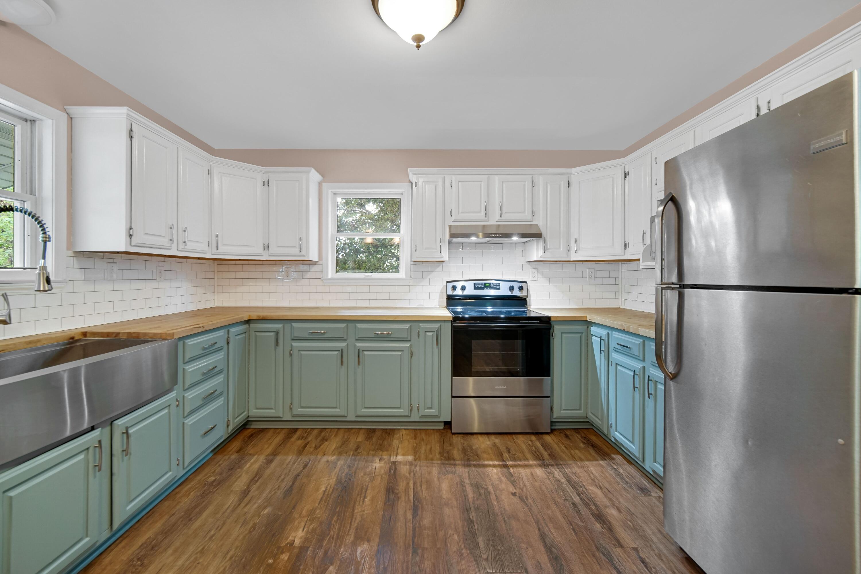 476 Highway 2 Hebron, IN 46341 - Photo 9 of 25 a kitchen with a refrigerator and a sink