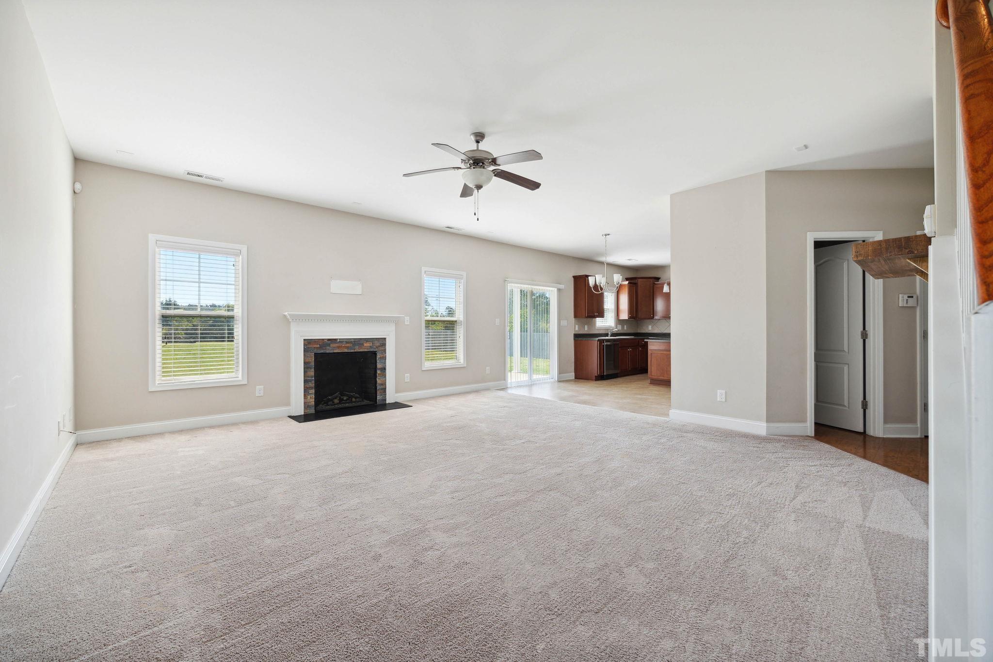 108 Riley Lane Cameron, NC 28326 - Photo 12 of 29 a view of an empty room with a fireplace