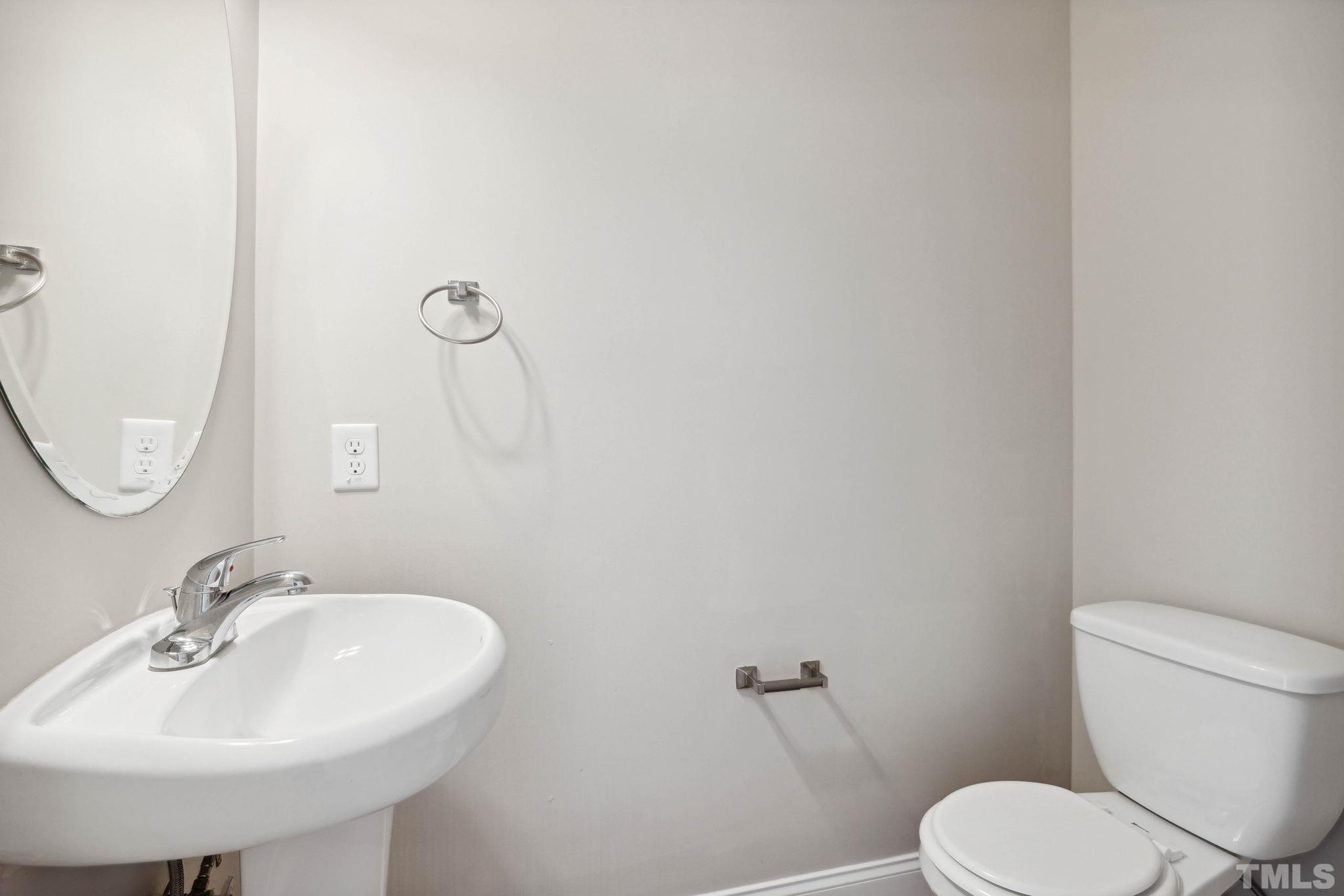108 Riley Lane Cameron, NC 28326 - Photo 13 of 29 a bathroom with a sink a mirror and a toilet