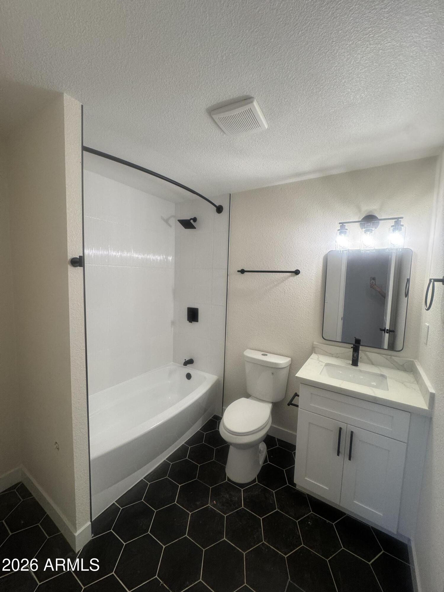 3337 West Ocotillo Road Phoenix, AZ 85017 - Photo 20 of 22 a bathroom with a sink toilet a mirror and shower